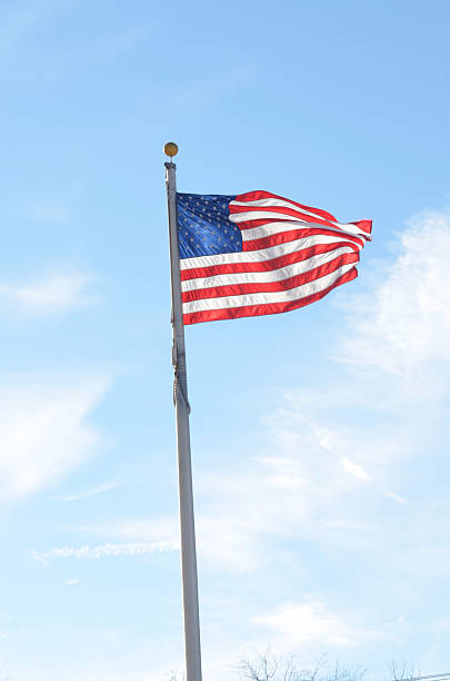 istock American flag waving in breeze 636036858