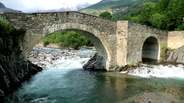 Rio Ara river and bridge San Nicolas de Bujaruelo in Ordesa Aragon Huesca Spain