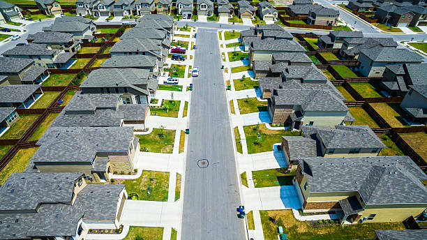 istock Rooftop Divide Aerial over Modern Suburb Austin 636039588