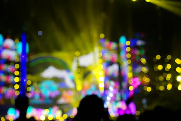 Defocused entertainment concert lighting on stage, blurred disco party.