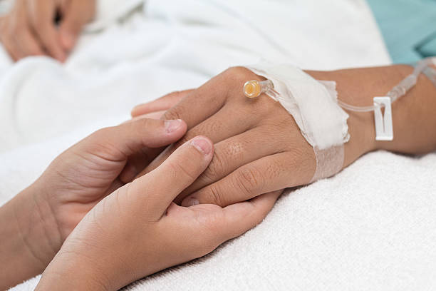 istock Child holding a Patient  his Mother's hand. 636040354