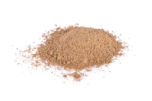 istock pile of ground nutmeg powder on white background 636040704