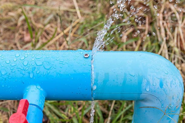 istock Water leaking from connection joint of plastic pipes system. 636041180