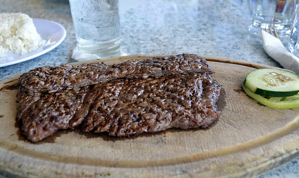 istock Fried steak Churrasco on wood plate 636043232