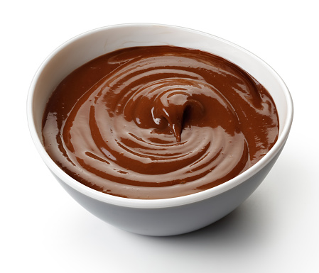 Chocolate pudding in a bowl isolated on white
