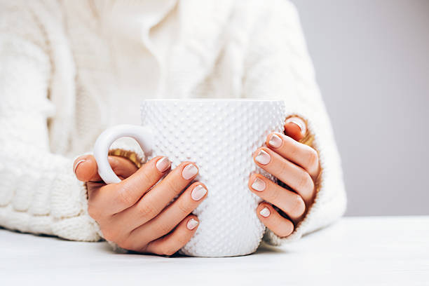 istock Woman with manicure and cup. 636044808