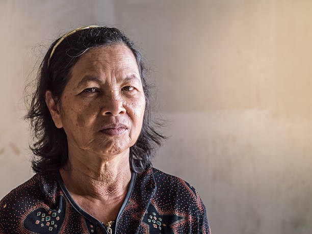 istock Close up old Thai woman portrait 636045672