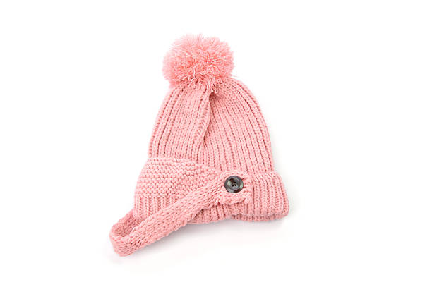 istock pink knitted hat with pompom isolated on white background 636048238
