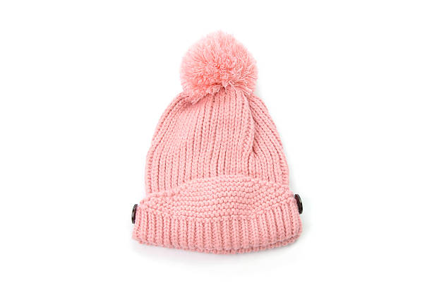 istock pink knitted hat with pompom isolated on white background 636048240