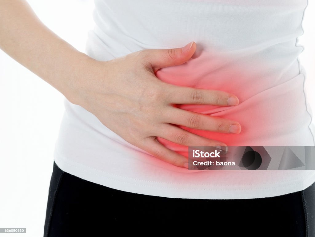 Young woman having stomach ache Abdomen Stock Photo