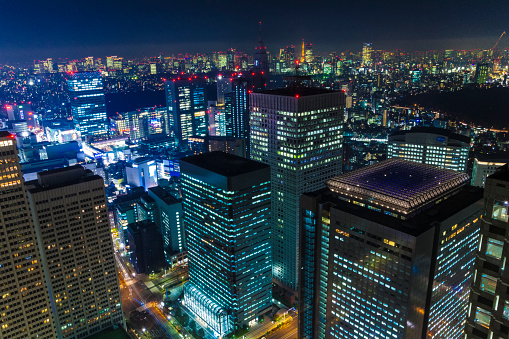 Night view of Tokyo is captured from a tall building in Shinjuku.