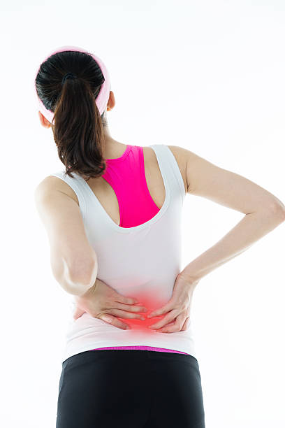 istock Young asian woman with back pain 636051664