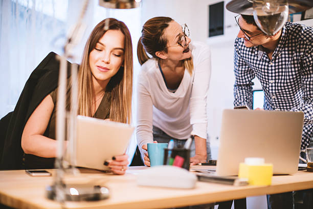istock Group of young people working together 636053160
