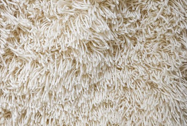 istock Detail of Cream Fluffy Fabric Texture Background 636057924