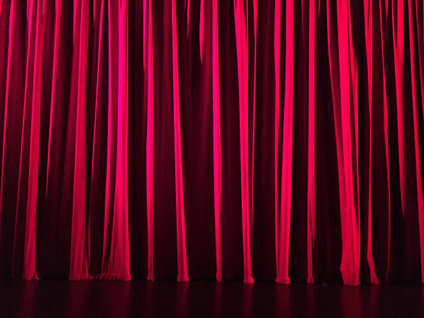 istock Red curtain in a theatre. Horizontal image. 636058454