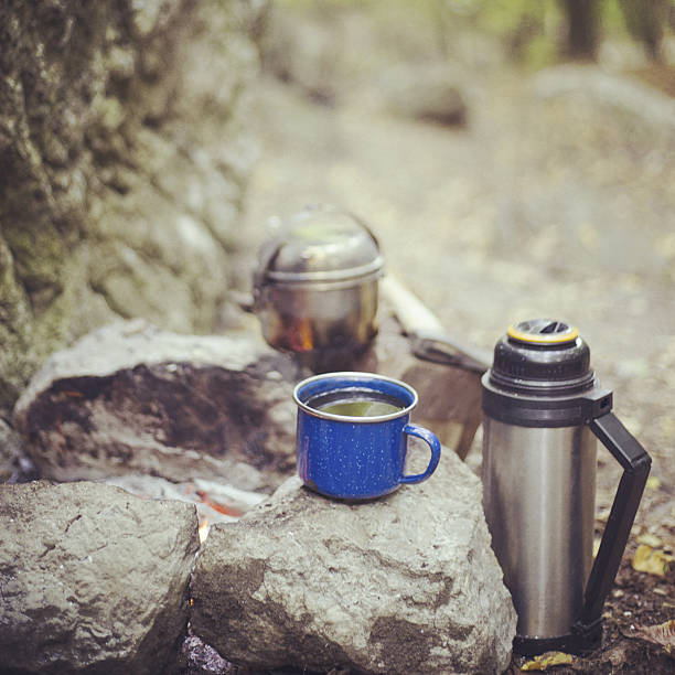 istock Cooking breakfast on a campfire at a summer camp. 636058916