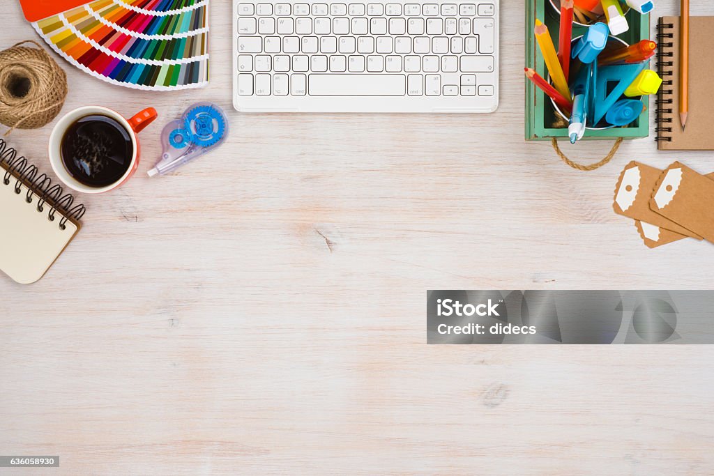 Designer workspace top view with essential elements on wooden board Pattern Stock Photo