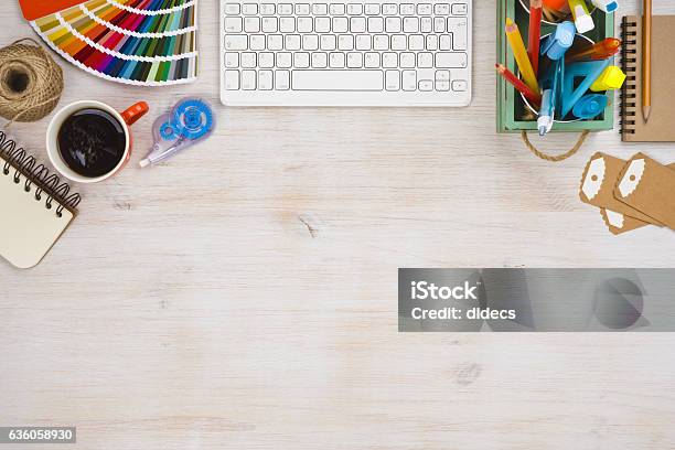Designer Workspace Top View With Essential Elements On Wooden Board Stock Photo - Download Image Now