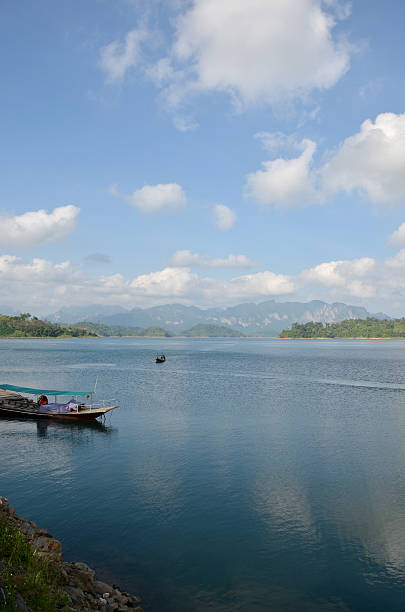 istock Thai people sail long tail boat in Cheow Lan Lake 636060428