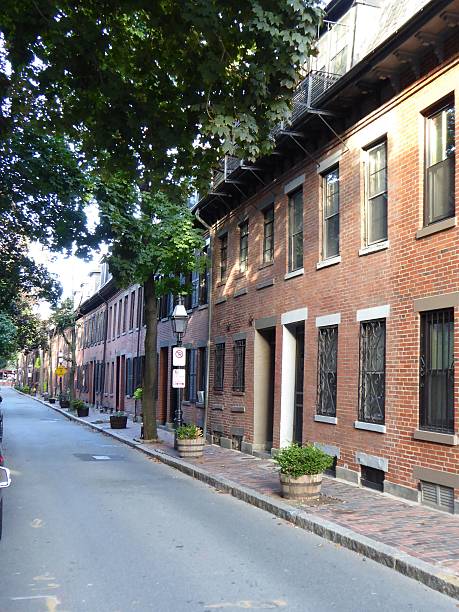 istock Downtown Boston MA red brick side street homes 636060642