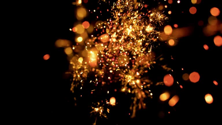 SLO MO Firecracker sparkles on black background