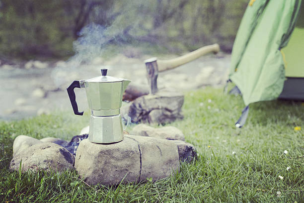 istock Cooking breakfast on a campfire at a summer camp. 636063528