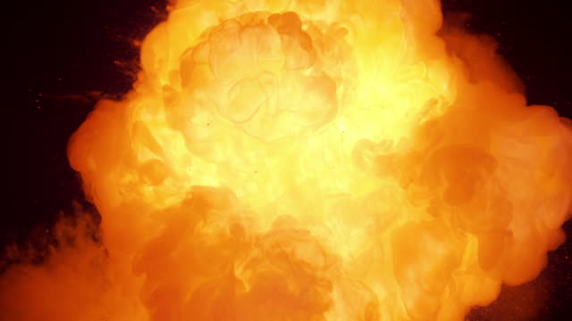 SLO MO Fire cloud bursting from black background