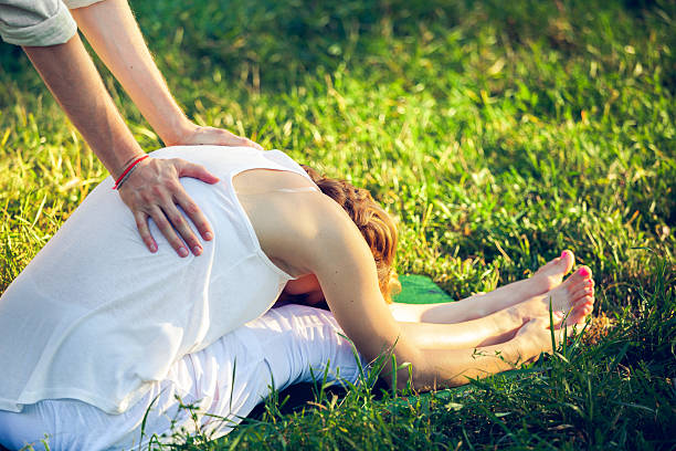 istock Thai massage with yoga exercises 636072954
