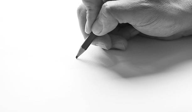 istock Pencil in hand on paper arts 636073058
