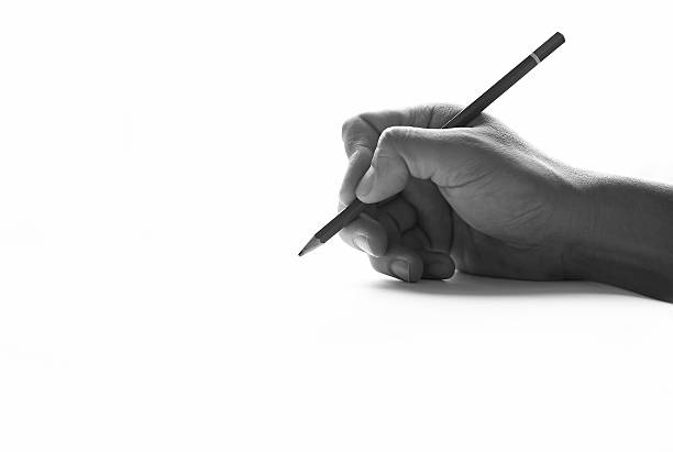 istock Pencil in hand on paper arts 636073132