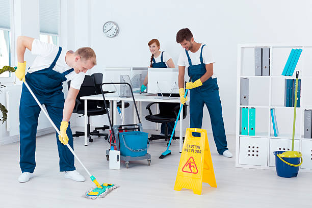 istock Cleaners cleaning an office 636074692