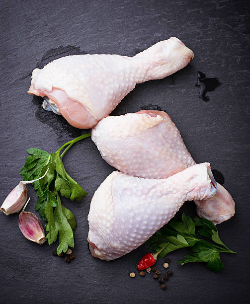 istock Raw chicken legs with parsley 636075156