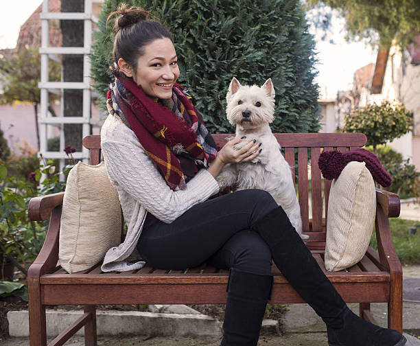 istock beautiful girl with dog 636075682