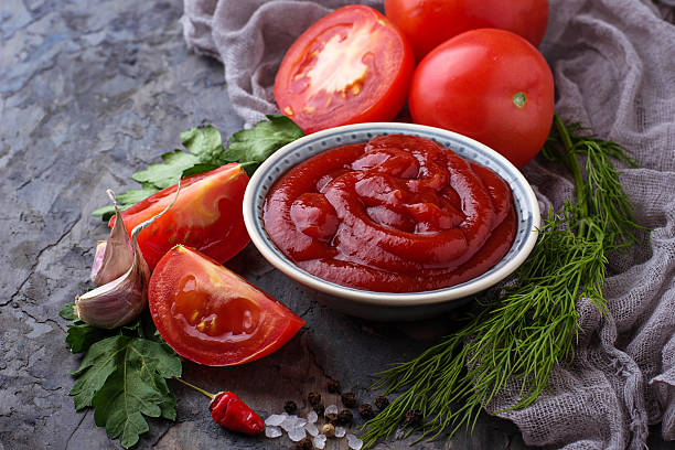 istock Tomato ketchup sauce on concrete background 636078170