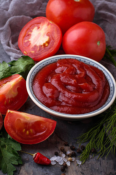 istock Tomato ketchup sauce on concrete background 636078196