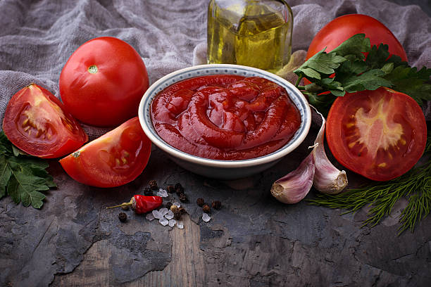 istock Tomato ketchup sauce on concrete background 636078276