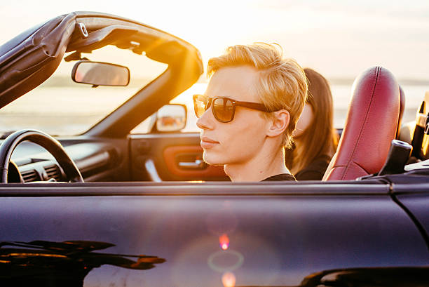 istock couple in cabriolet 636078278