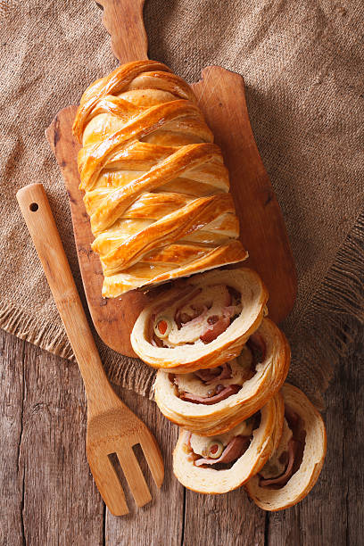 istock sliced bread stuffed with ham and olives close-up vertical 636078374
