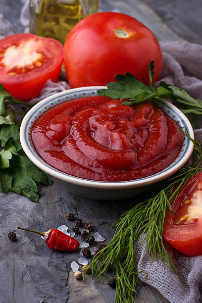 istock Tomato ketchup sauce on concrete background 636078492
