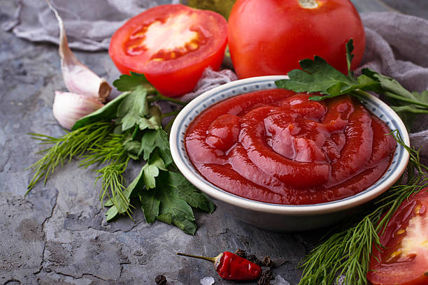 istock Tomato ketchup sauce on concrete background 636078528