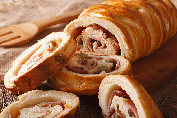 istock sliced bread stuffed with ham and olives macro. horizontal 636078834