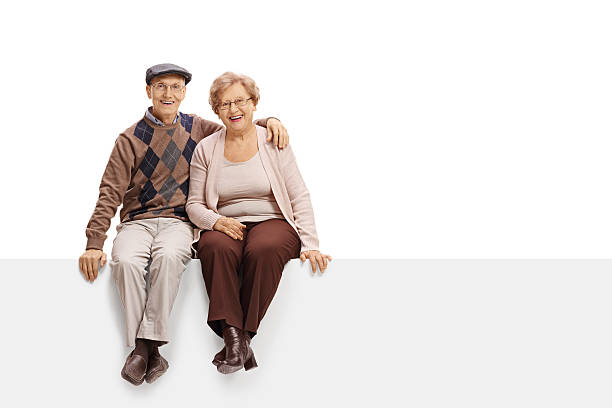 istock Happy mature couple sitting on a panel 636078916