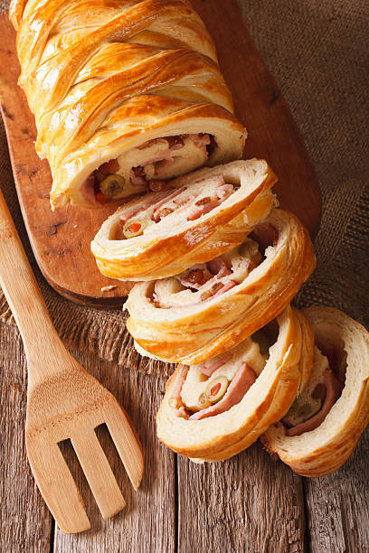 istock Venezuelan bread pan de jamon close-up on the table. vertical 636079234