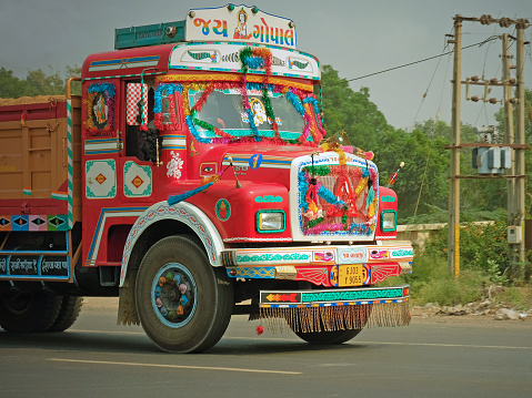 Gujarat, India - November 4, 2016: The brightly painted cab of a truck on the state highway. As is the case in other countries in South Asia, many Indian trucks are elaborately decorated by their drivers
