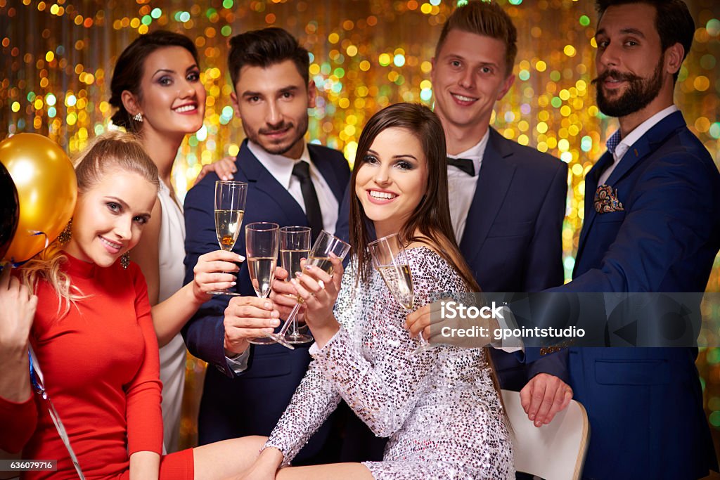 Friends gathered to celebrate a party Formalwear Stock Photo