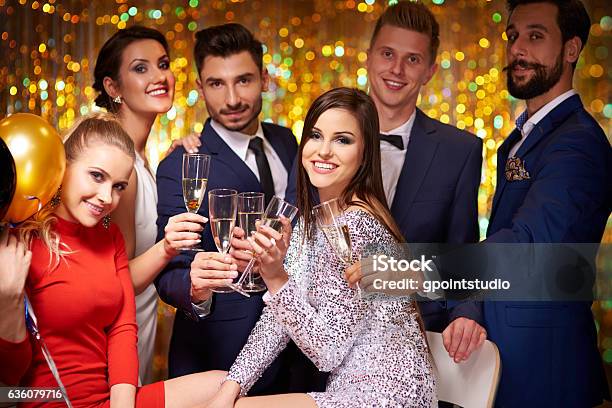 Friends Gathered To Celebrate A Party Stock Photo - Download Image Now - Formalwear, Party - Social Event, Alcohol - Drink