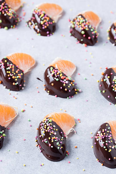 istock mandarine, tangerine fruits covered chocolate 636080690