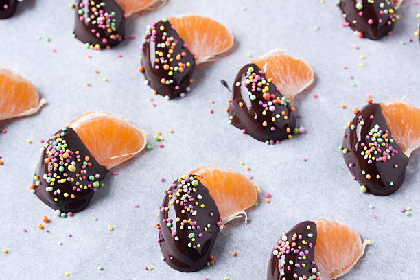 istock mandarine, tangerine fruits covered chocolate 636082242