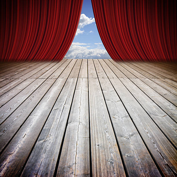 istock Open theater red curtains and wooden floor 636082444