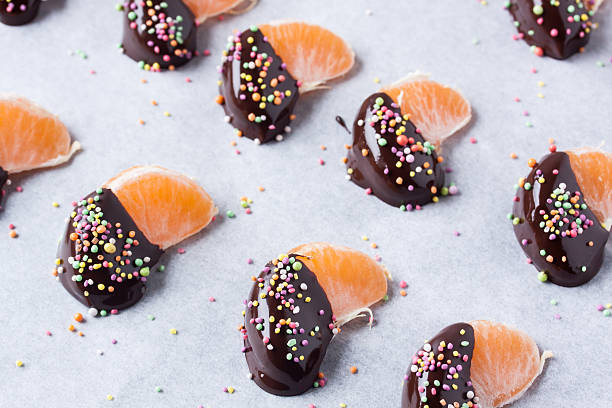istock mandarine, tangerine fruits covered chocolate 636082804